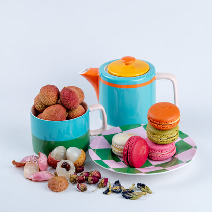 Ceri Coffee co-ferment coffee tasting note is a plate with lychees and macarons on a white background.